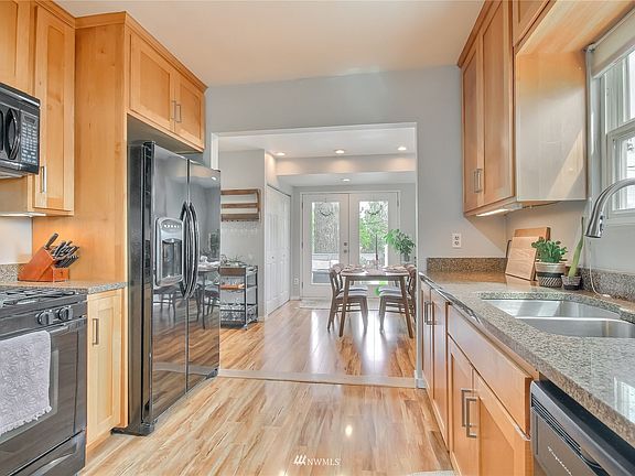 Updated kitchen with custom maple cabinets