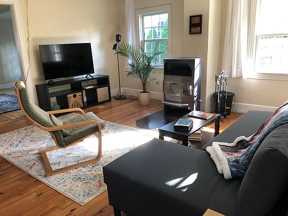 Living room w 50" TV and Danish woodburning stove