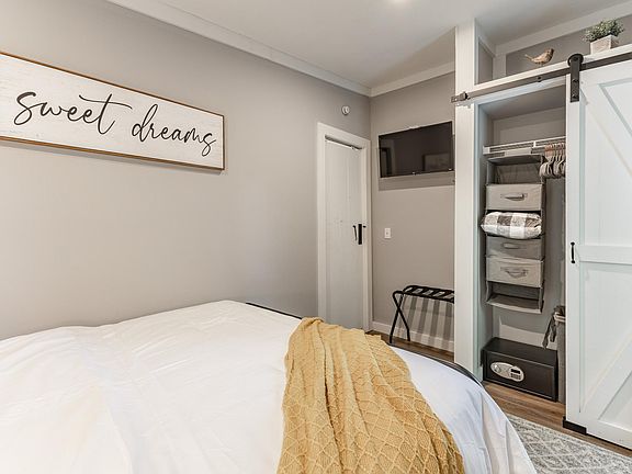 Your own TV to watch your favorite shows and a barn door closet to place all your belongings.
