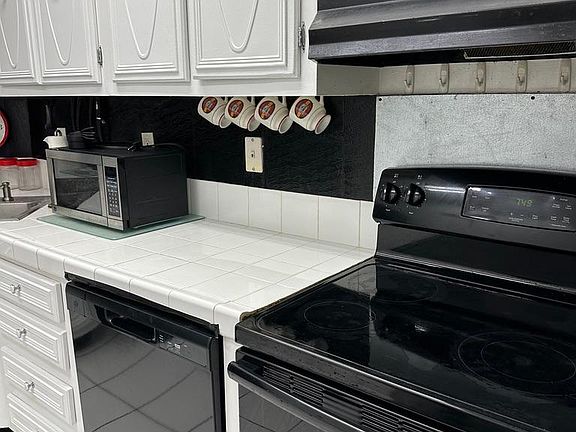 Kitchen: New microwave and dishwasher.