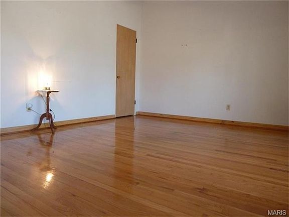 The 17 x 12 living room has beautiful wood floors, a coat closet and a vaulted ceiling.