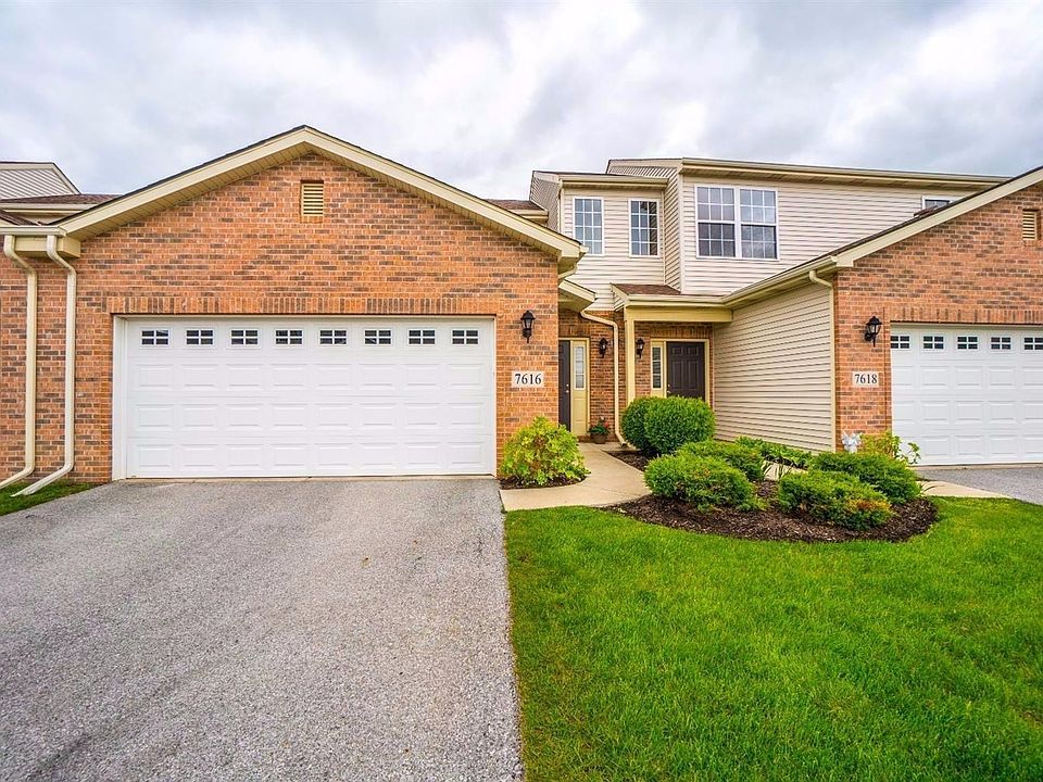 UPGRADED FULL BRICK FRONT W/UPGRADED GARAGE DOOR W/WINDOWS!