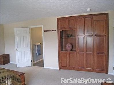 Master Bedroom : Master bedroom features additional built in storage cabinetry.