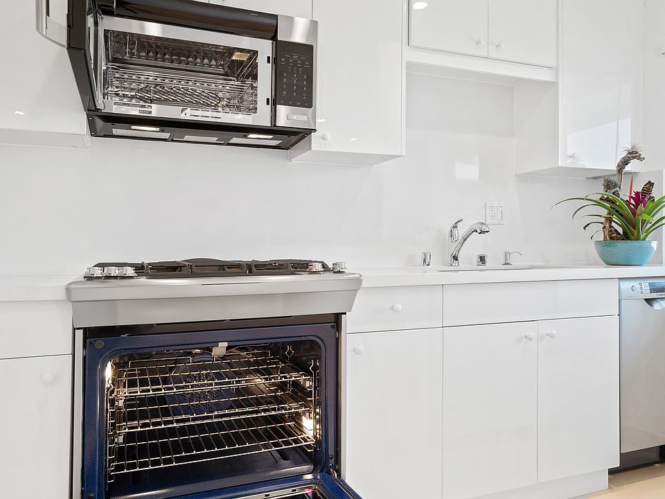 New Electrolux 6 burner stove/oven with new Bosch dishwasher & convection microwave