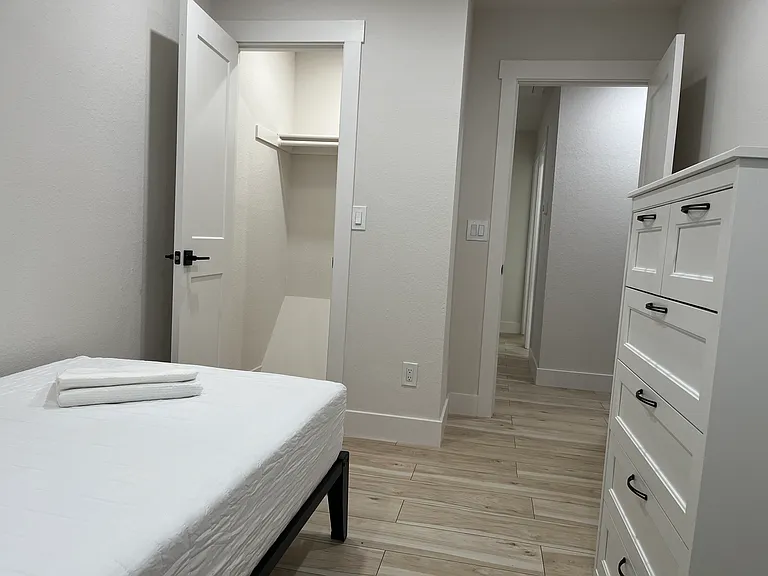 Secondary Bedroom #2: Each secondary bedroom is furnished with TwinXL bed and headboard, tall dresser, desk, and chair. Each secondary bedrooms has a walk in closet space and ceiling fan with LED lighting as well.