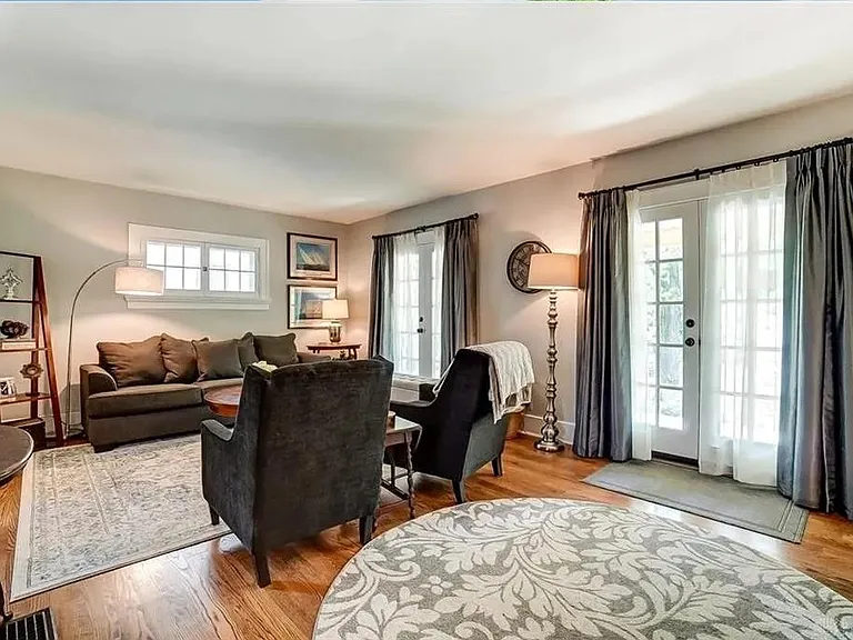 Living room with French doors opening onto the front porch