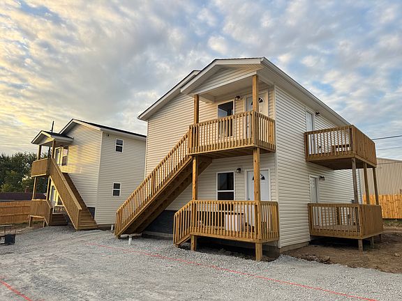 Exterior view of 2 buildings, 4 units shown here
