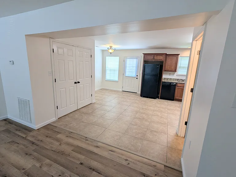 Laundry closet, dining area, kitchen