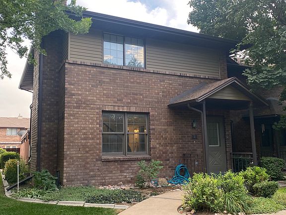 Front entrance, walk, flowerbed.