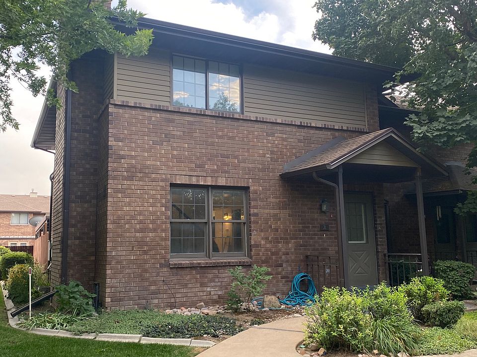 Front entrance, walk, flowerbed.