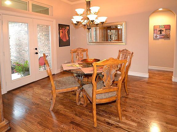 Formal dining room with doors opening to covered porc