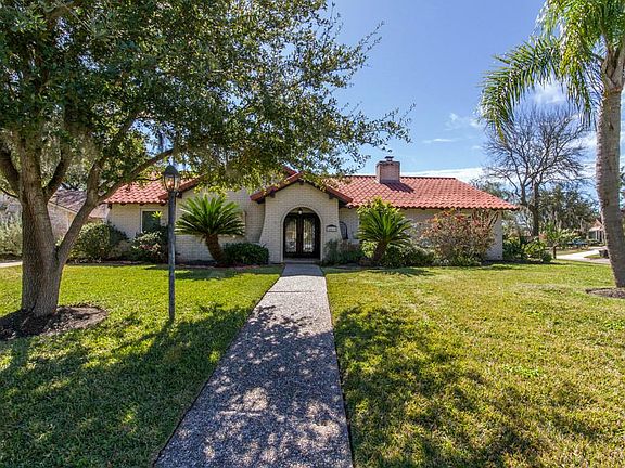Added gorgeous double glass front doors with wrought iron.
