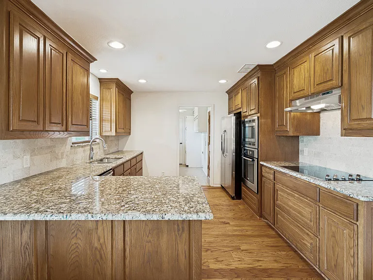 Kitchen with barstool counter.