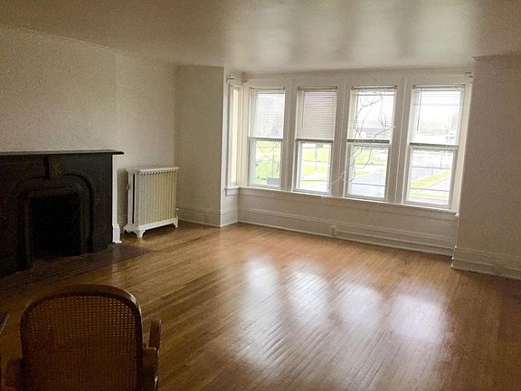 Gorgeous living room, freshy painted, rich wood floors, lots