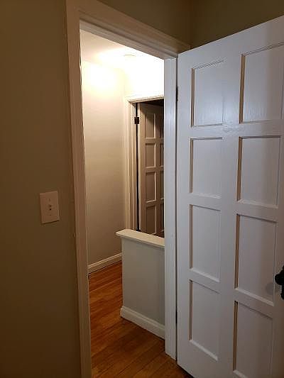 smaller bedroom door to hallway