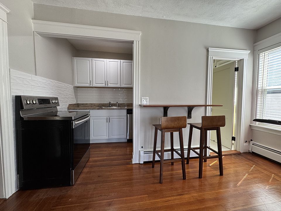 Kitchen. Entry to bedroom on left; bathroom door on right.