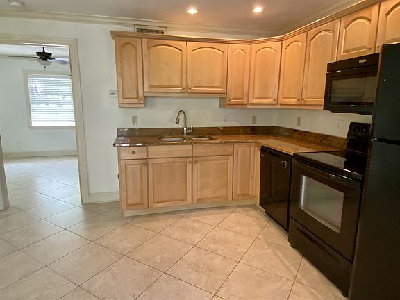 Nice size kitchen with granite countertops and lots of cabinets for plenty of storage.