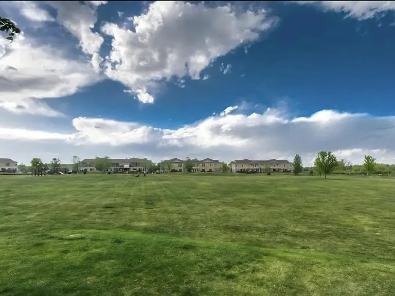 Open field owned by the HOA adjacent to the Cherry Creek trail--