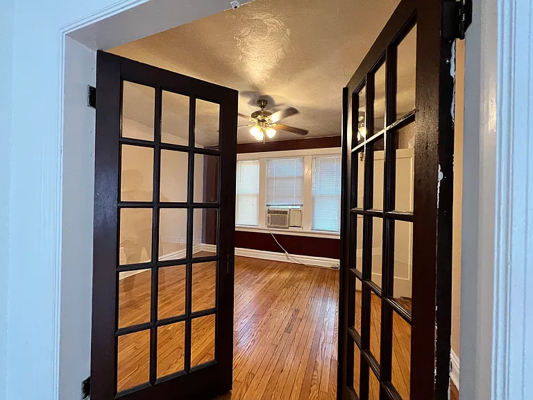 The double French doors open up into the next main room. Often used as the dining space.