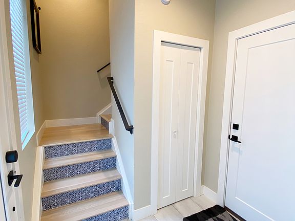 Entry, coat closet, stairs to next level