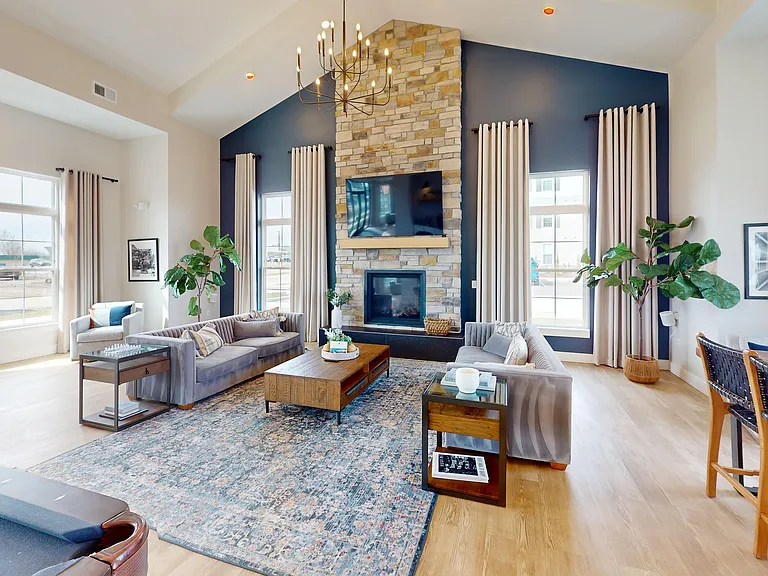 A cozy spot for catching up, kicking back, or letting the fireplace do its thing while the TV plays in the background.