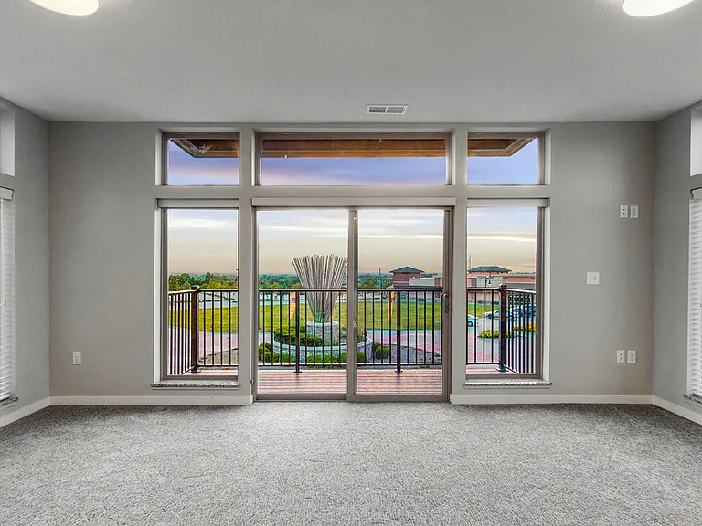 Apartments feature large windows offering scenic views and natural light.