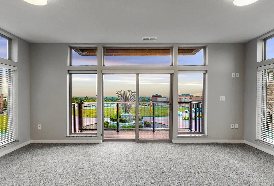 Apartments feature large windows offering scenic views and natural light.