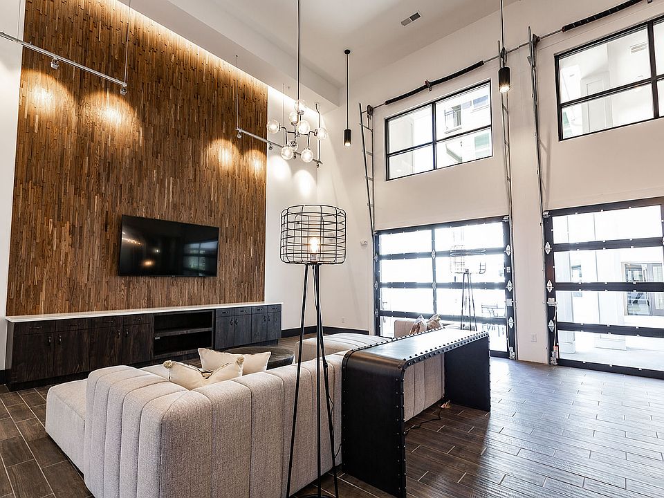 Experience luxury in this stylish living room bathed in natural light.