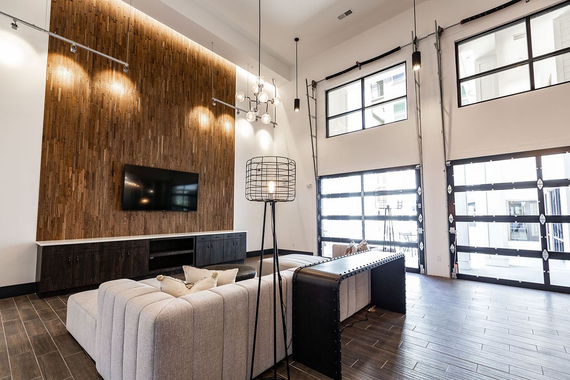 Experience luxury in this stylish living room bathed in natural light.