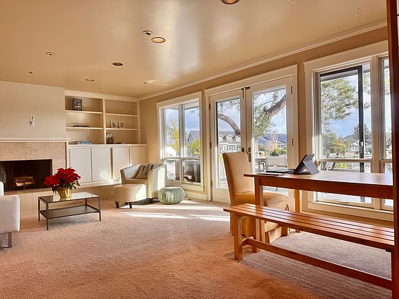 Your own private living room area with fireplace overlooking the lagoon