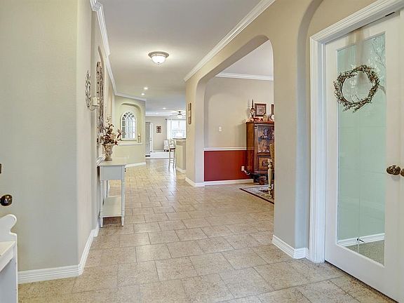 Study located to the right of the Entry. Beautiful glass-paned doors allow visibility to the Main Living Area while maintaining some privacy. Nice, open flow to Formal Dining Area.