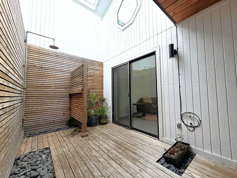 Designer Zen Garden Atrium with shower. Access via living room and master bedroom.