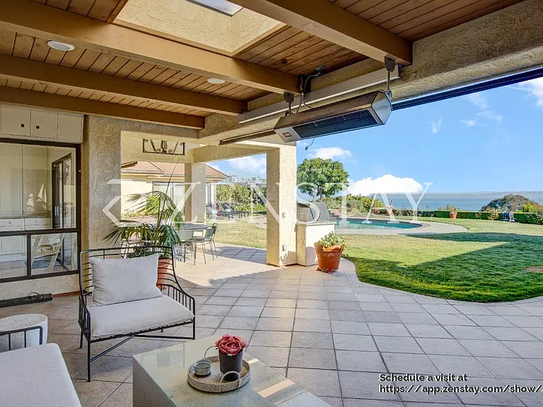 Outdoor seating area ideal for relaxing, dining, and entertaining year-round
