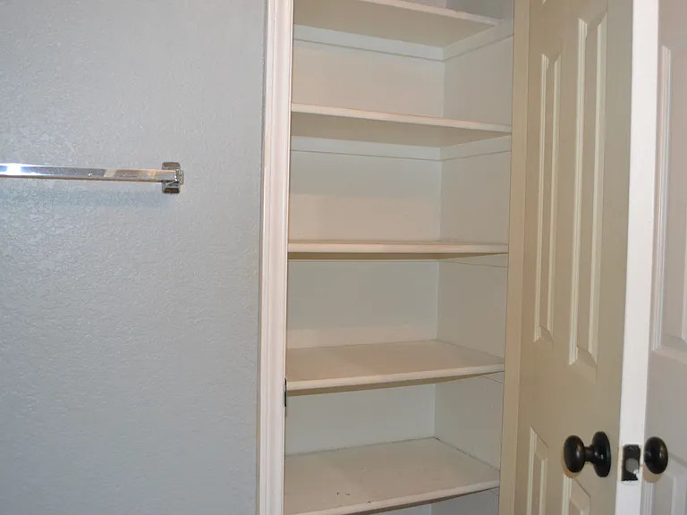Hallway bathroom pantry.