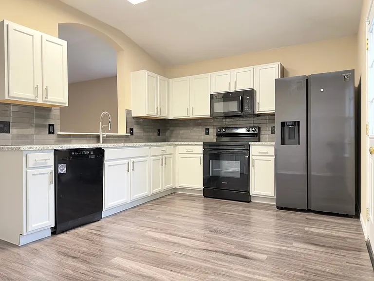 Kitchen with Granite countertop and electric stove