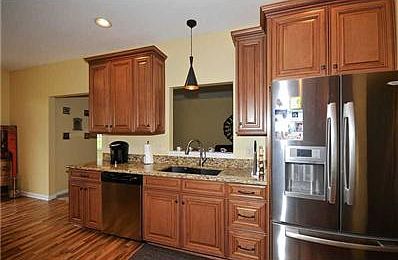 Kitchen. Stainless steel kitchen appliances stay.  The pass-through to the great room adds an open feeling.