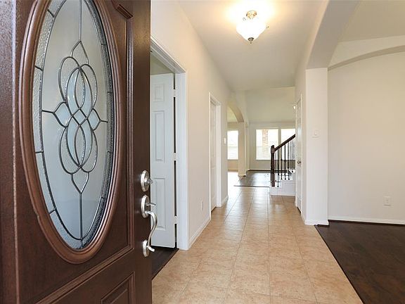 Welcome home! Enter on tile floor with engineered wood throughout the rest of the 1st floor. High ceilings overhead compliment the spacious rooms.