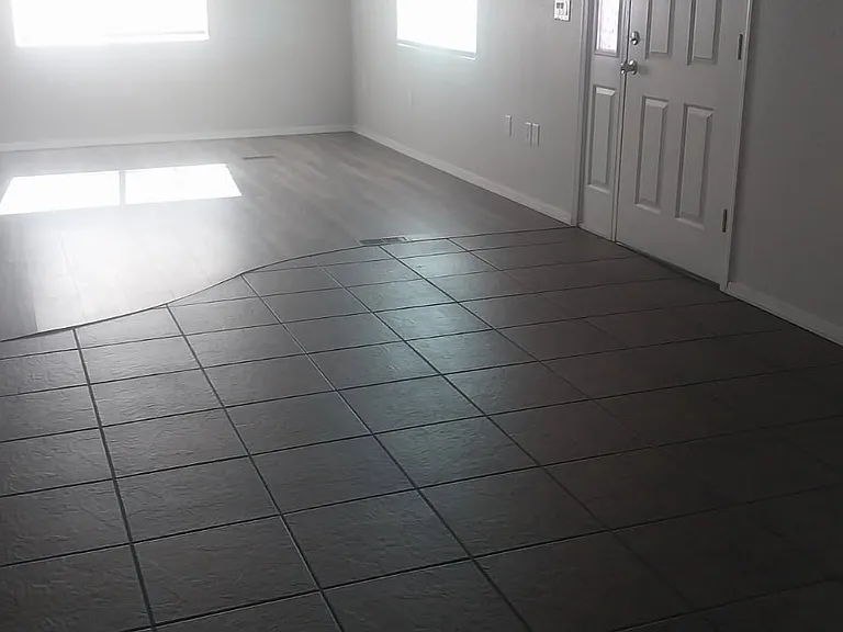 New wood flooring has replaced carpet throughout home.