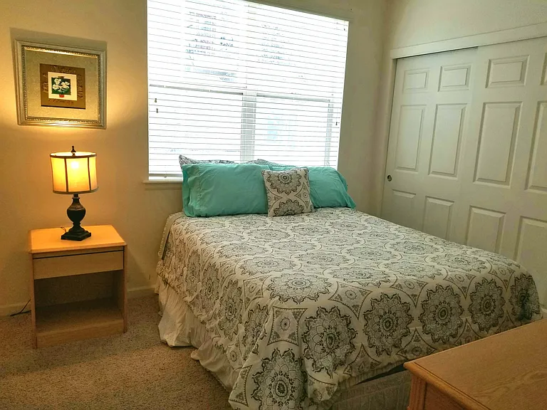 SECOND BEDROOM HAS A QUEEN SIZED BEDROOM ADJACENT TO THE BATHROOM