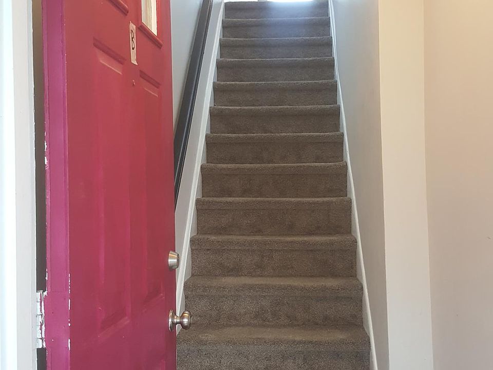 Red front door 204 B Chaucer Court.