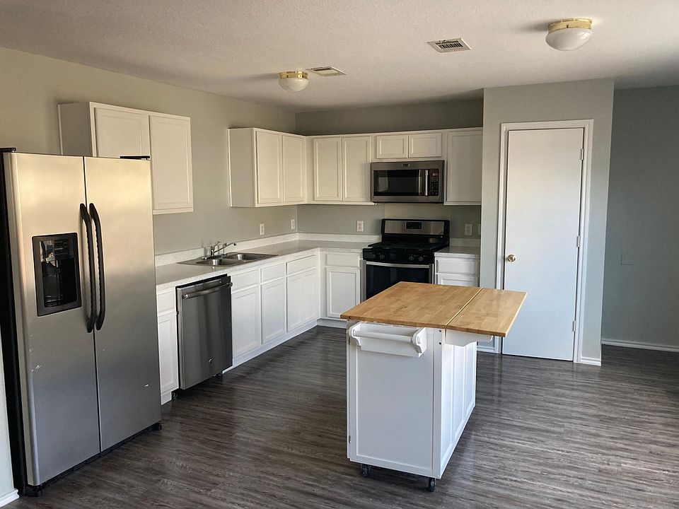 Stainless Steel Kitchen opens to the dining and living room. Movable island adds cooking space.