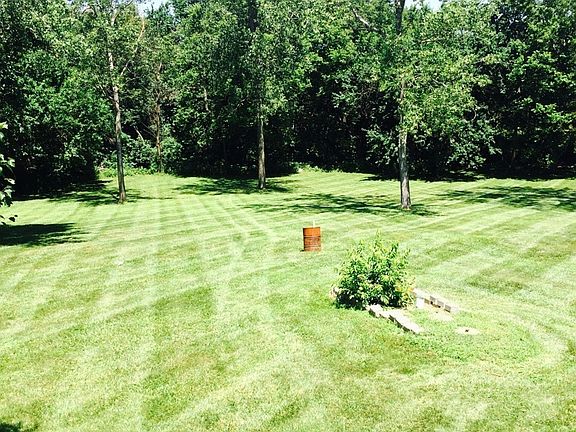 Lovely open back yard, lawn tractor provided