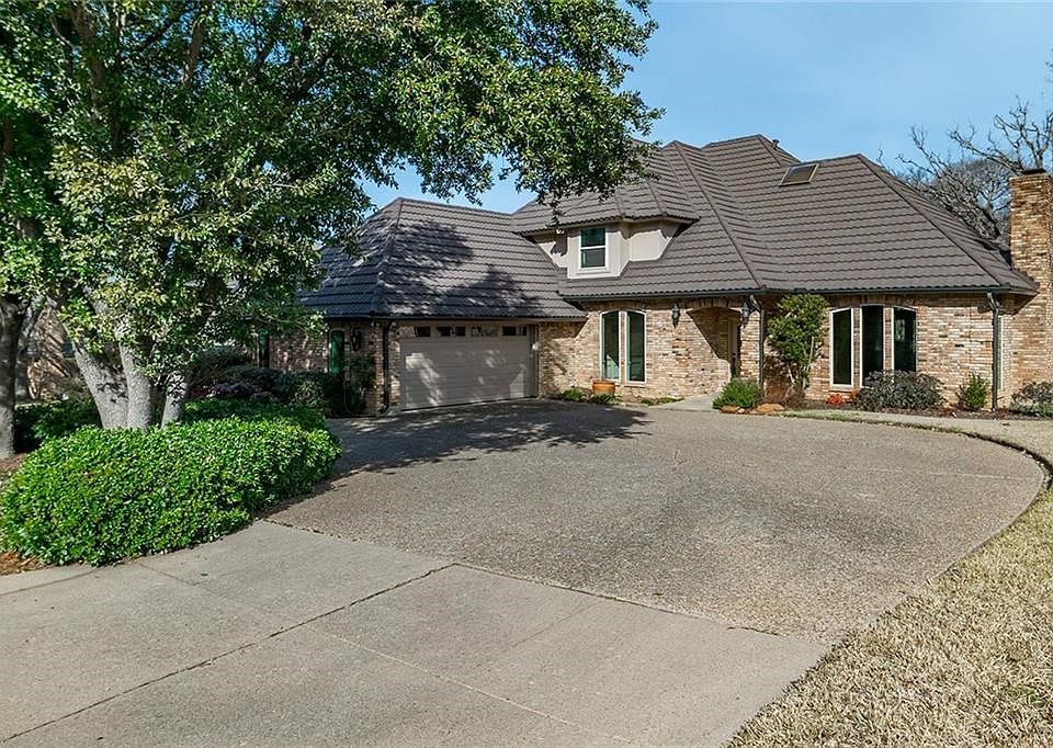 Notice circle drive way and awesome metal roof