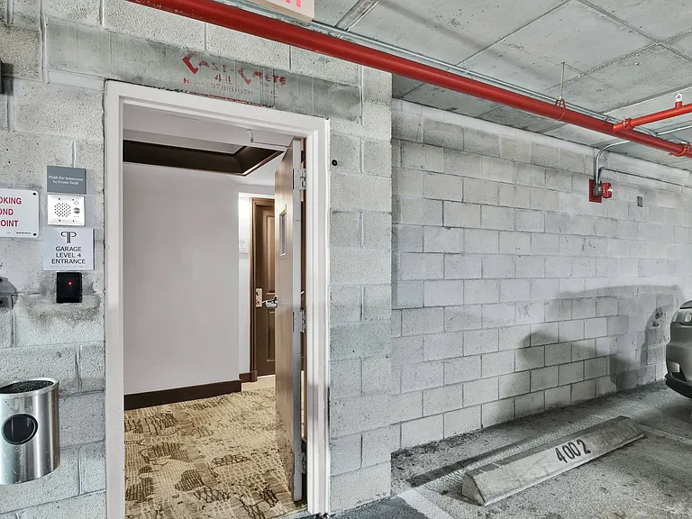 Condo unit entrance as seen from reserved parking spot, an estimated 6 feet.