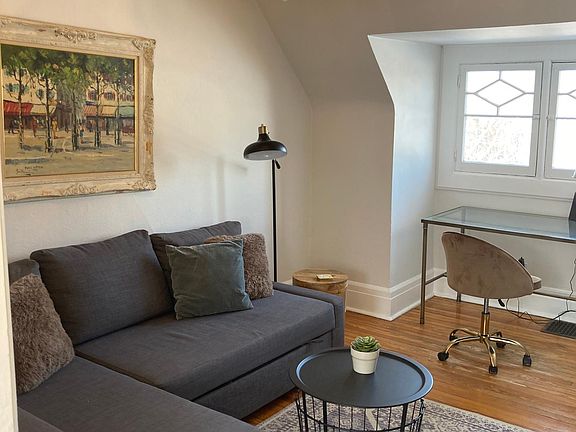 Cozy living room with dedicated workspace.