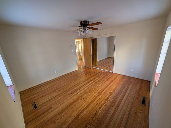 Bedroom with larger closet (behind sliding mirror doors)