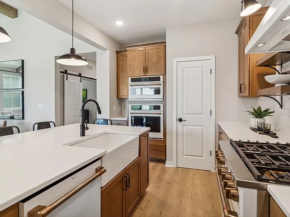 Kitchen with apron sink in island
