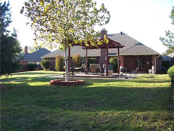 Extended flagstone patio with pergala