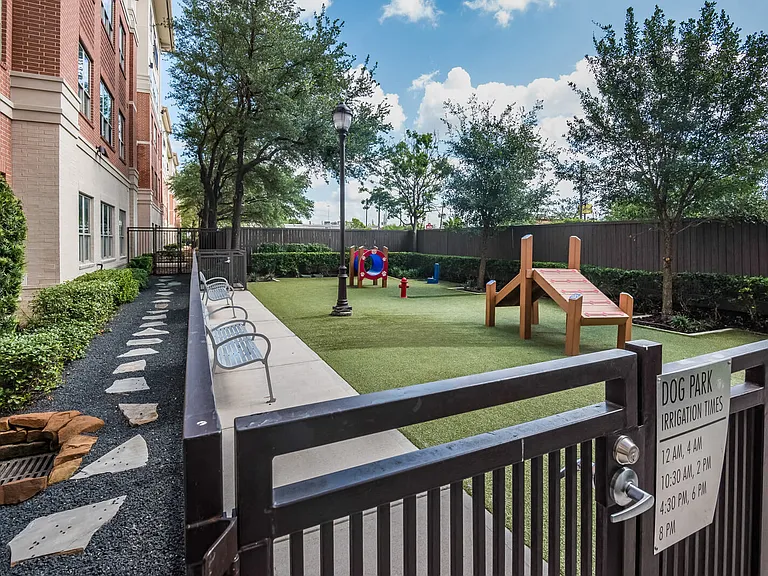 Enclosed pet park with obstacle course