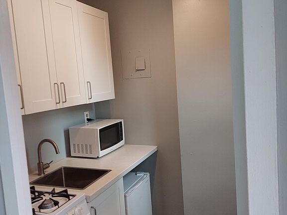 Modernized kitchen w/ brand new appliances and fixtures and cabinetry.